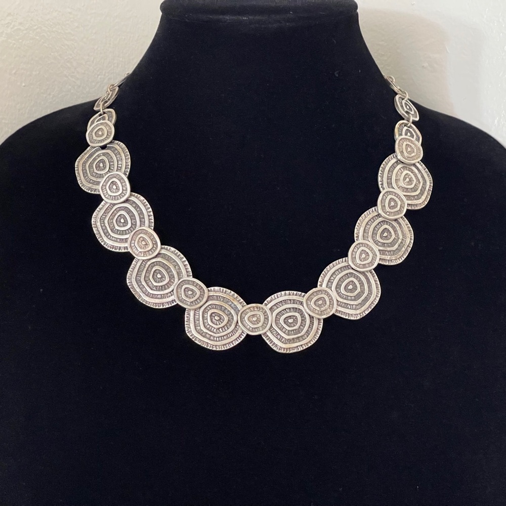 Silver plated spiral necklace.